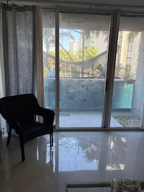 Two workers on scaffolding outside our room