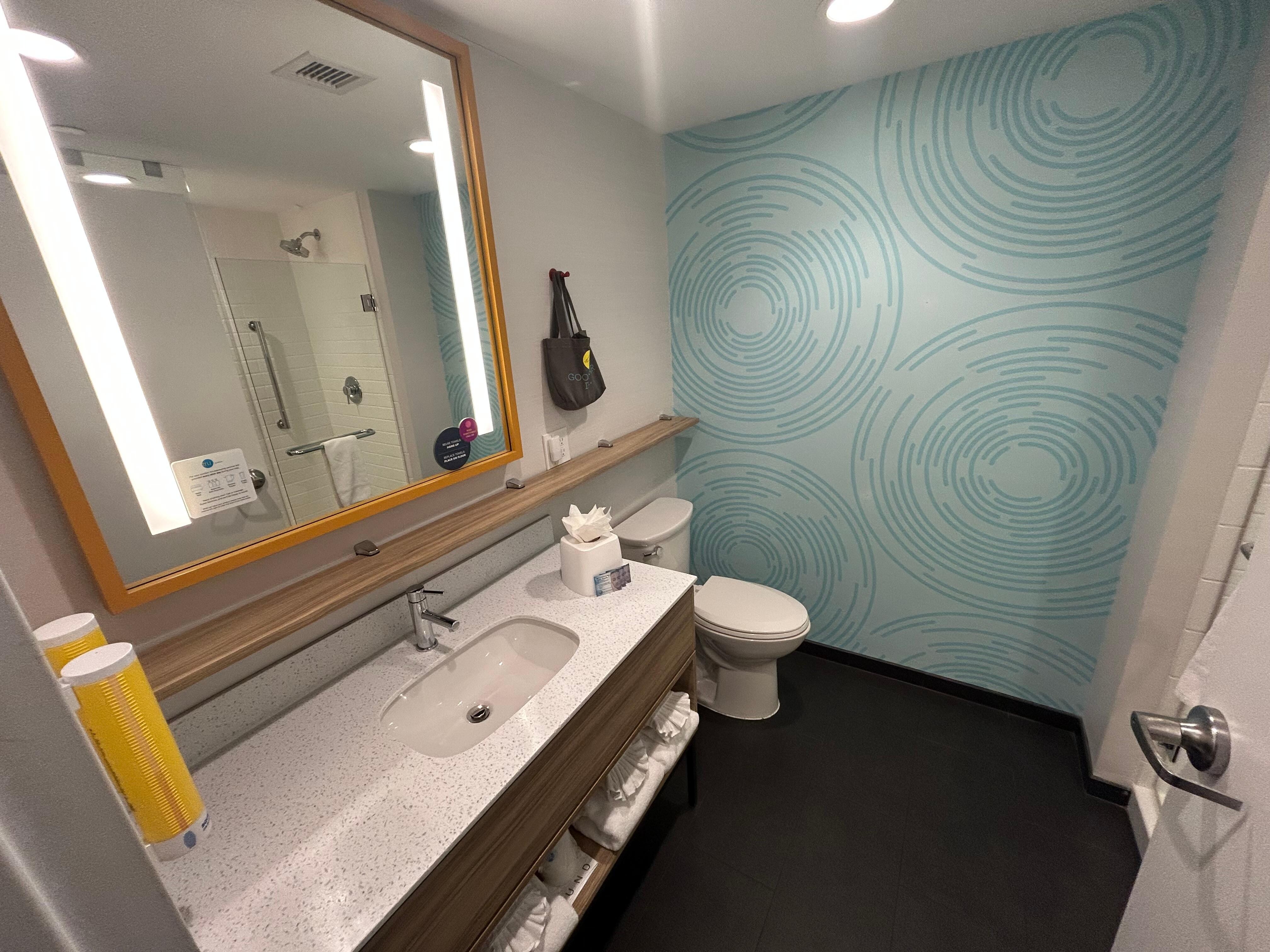 Spacious bathroom with walk in shower.