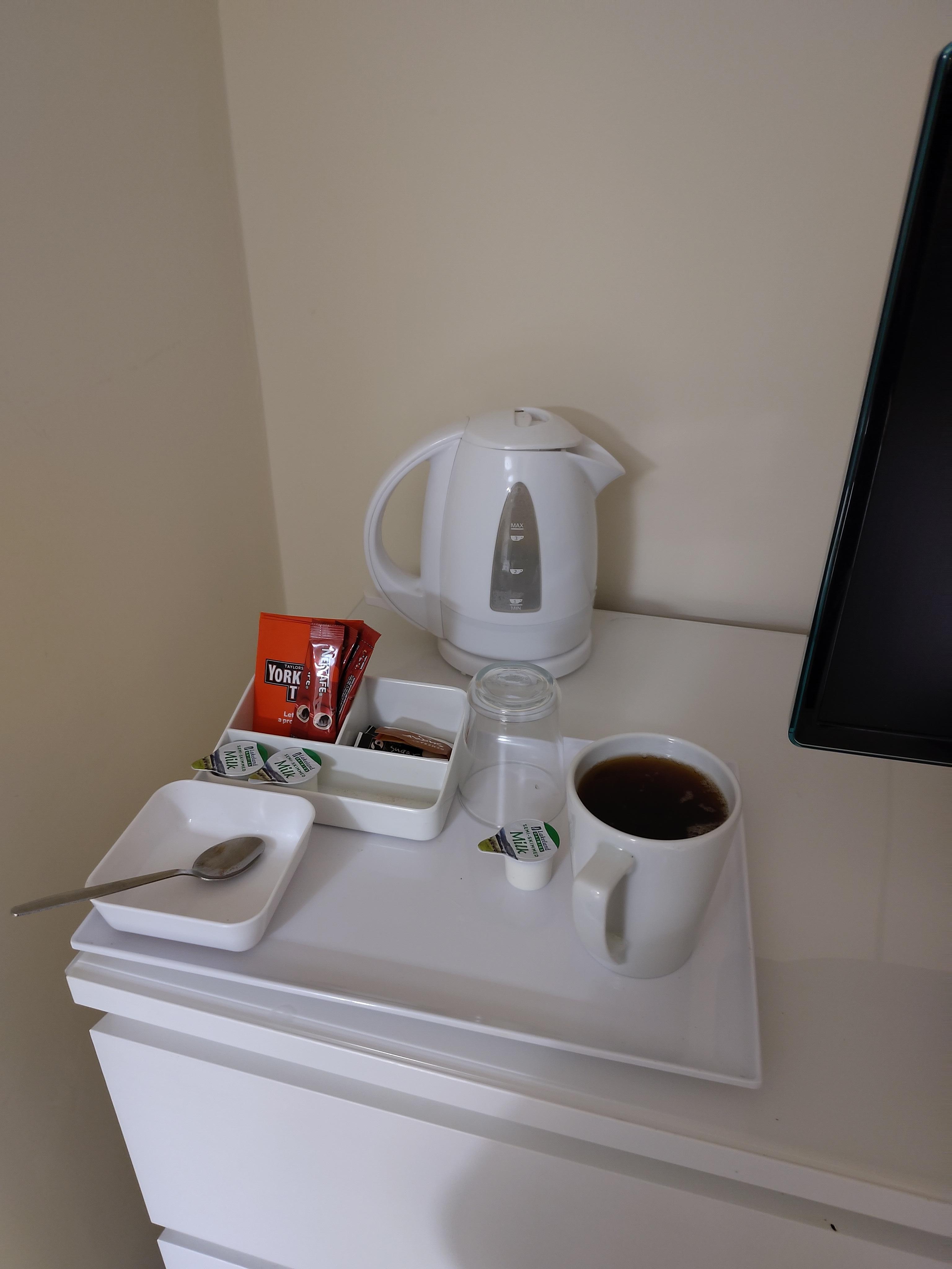 Tea and coffee station next to the telly.