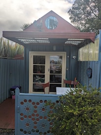 Front entrance with sheltered seating area.