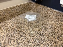 A shower cap and make-up remover sheet.