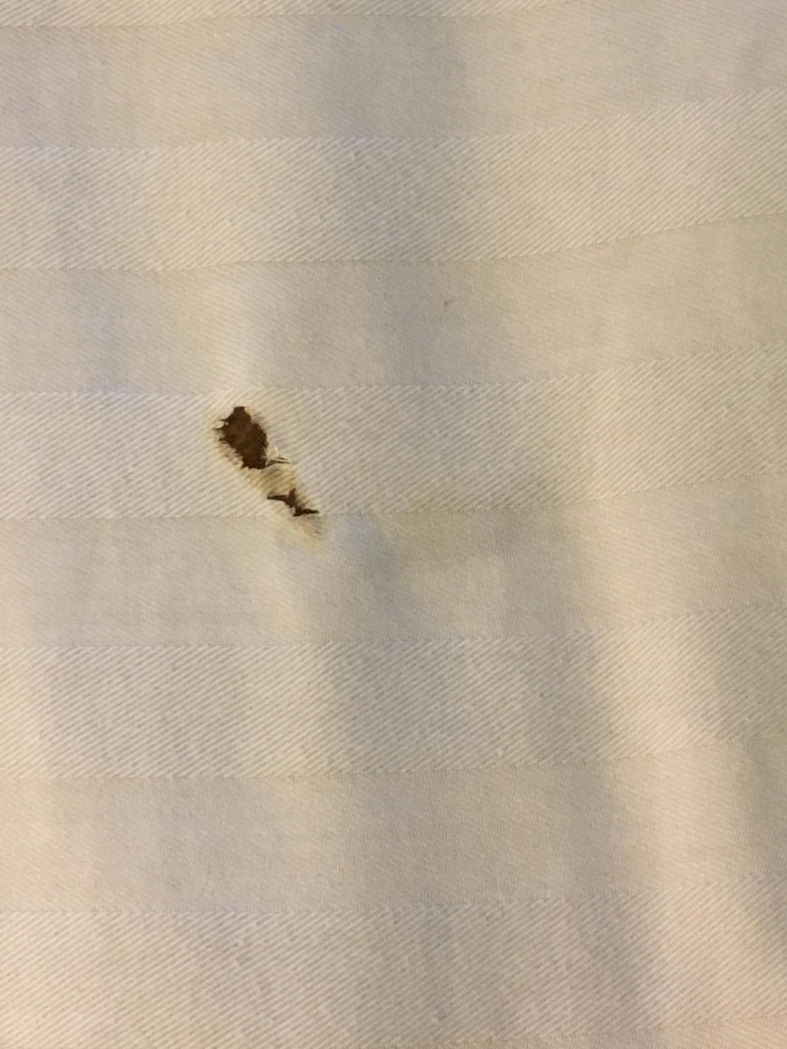 Cigarette holes in the comforter