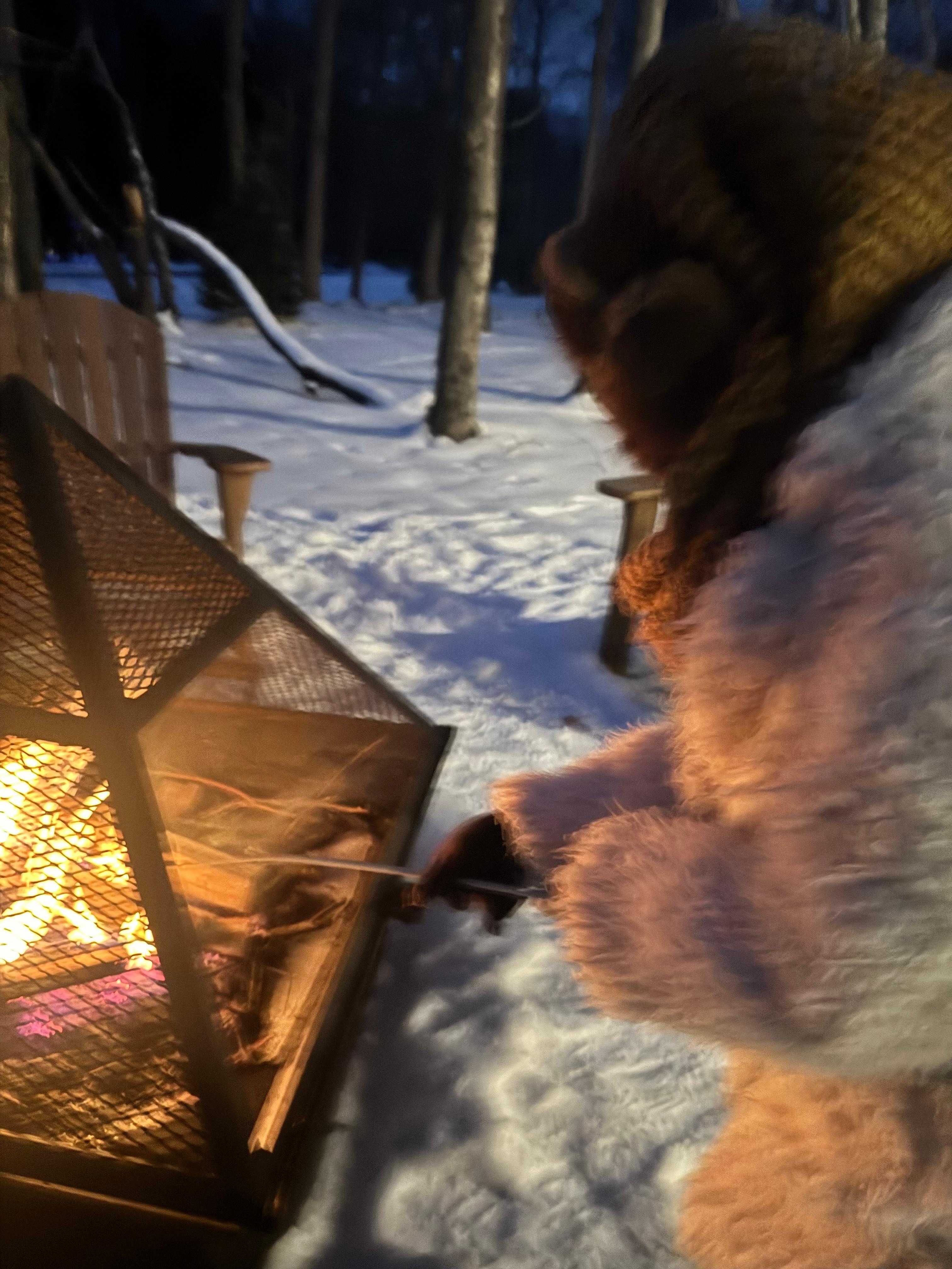 My grand daughter making smores
