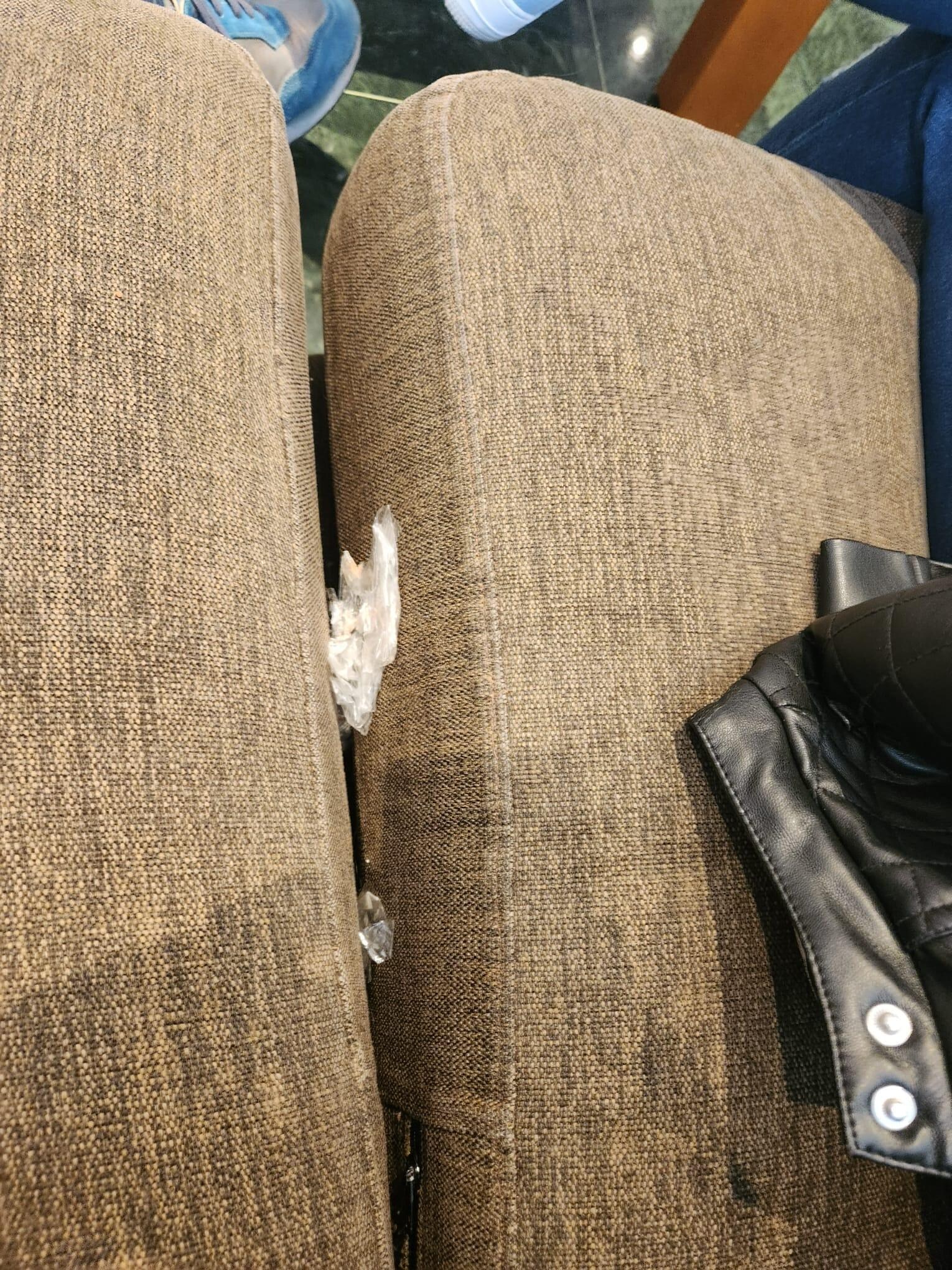 Sofa in Hotel Lobby: partition between 2 seats