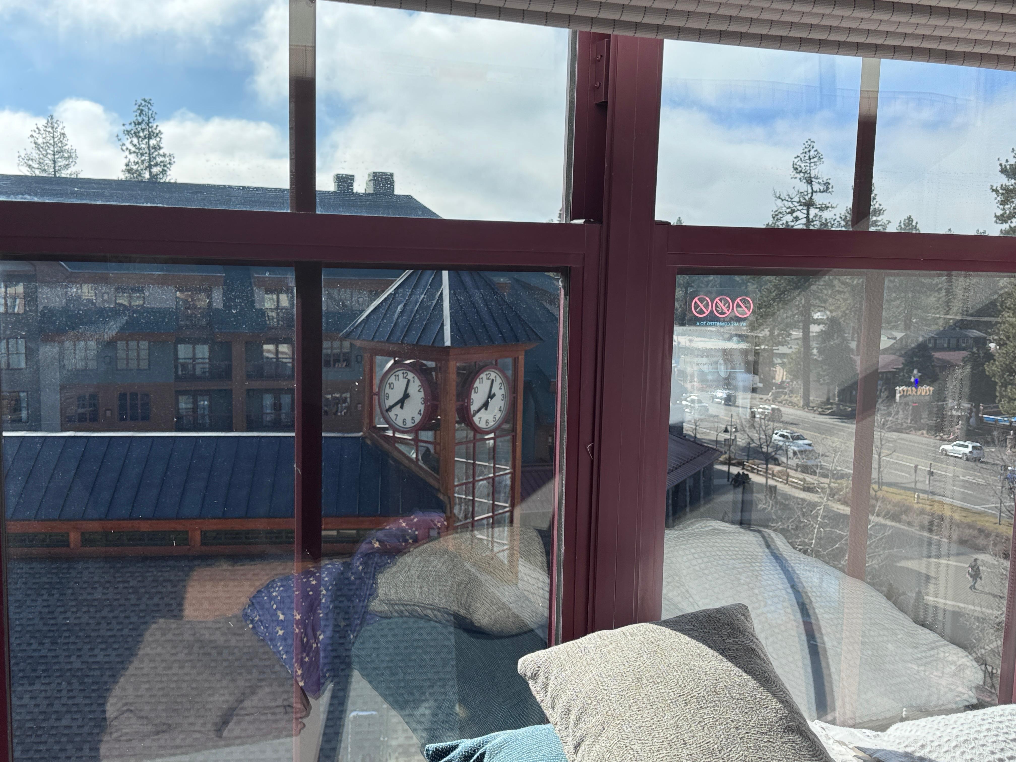 View of clock tower  out the window of 5th floor facing the gondola station .