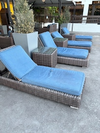 The patio furniture at the swimming pool