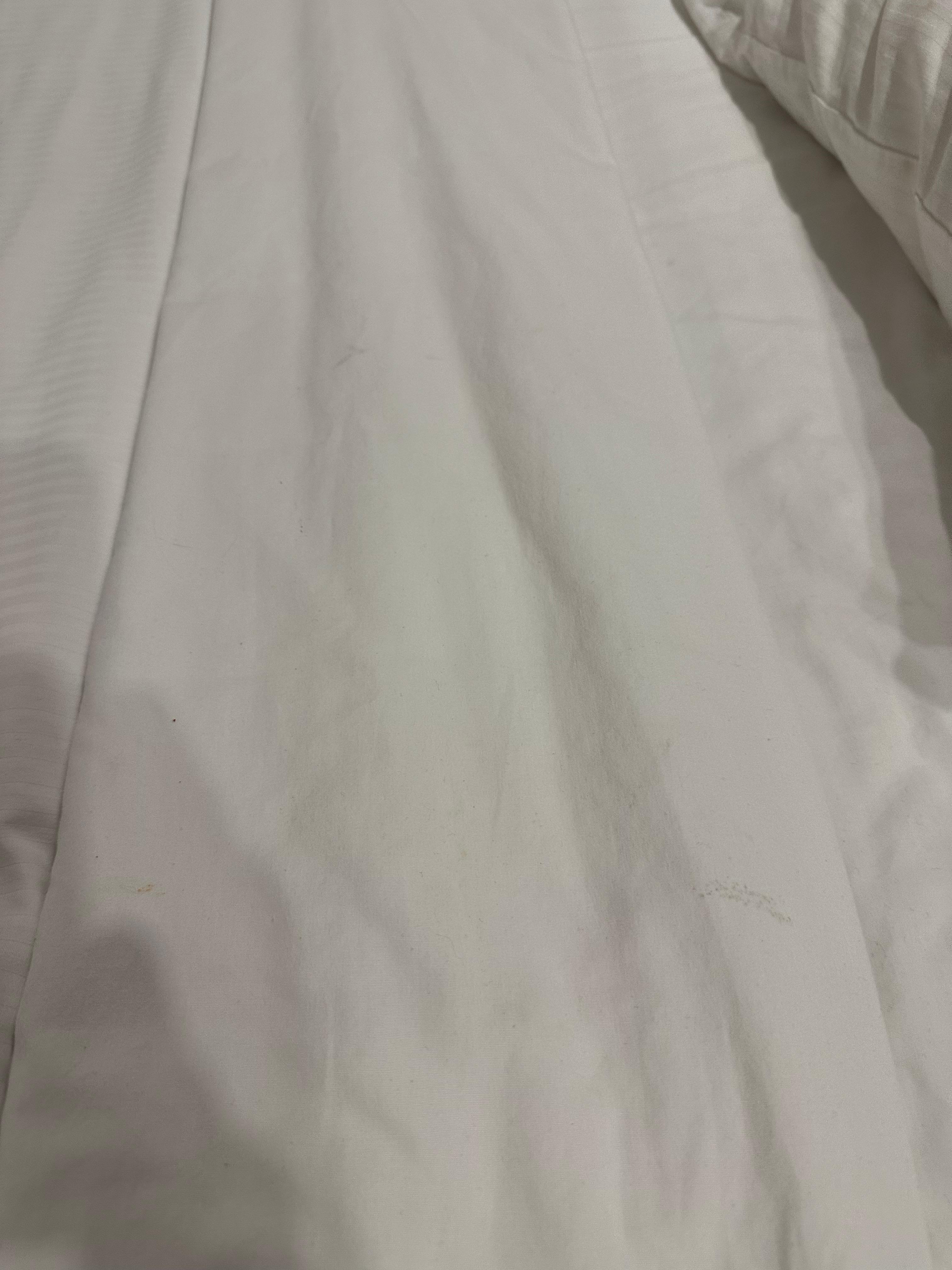 If you zoom in you can see they’re clearly dirty sheets & not just stained from previous guests.