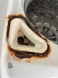 Washing Machine. That is not just rust on the surface, it is actually rusted through. Claim by the host that the last guest damaged it and that was why it was inoperable.