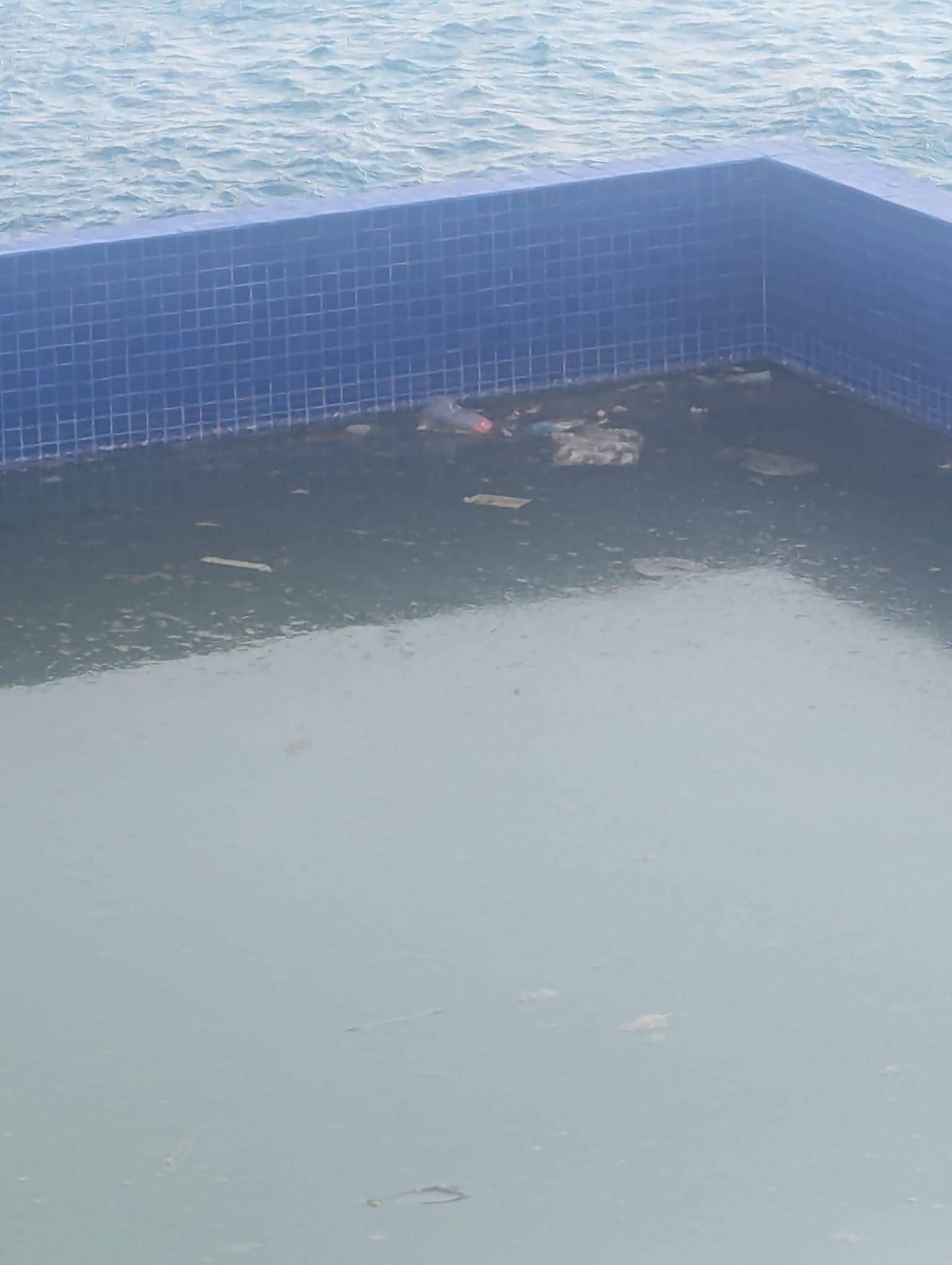 Run down pool full of trash