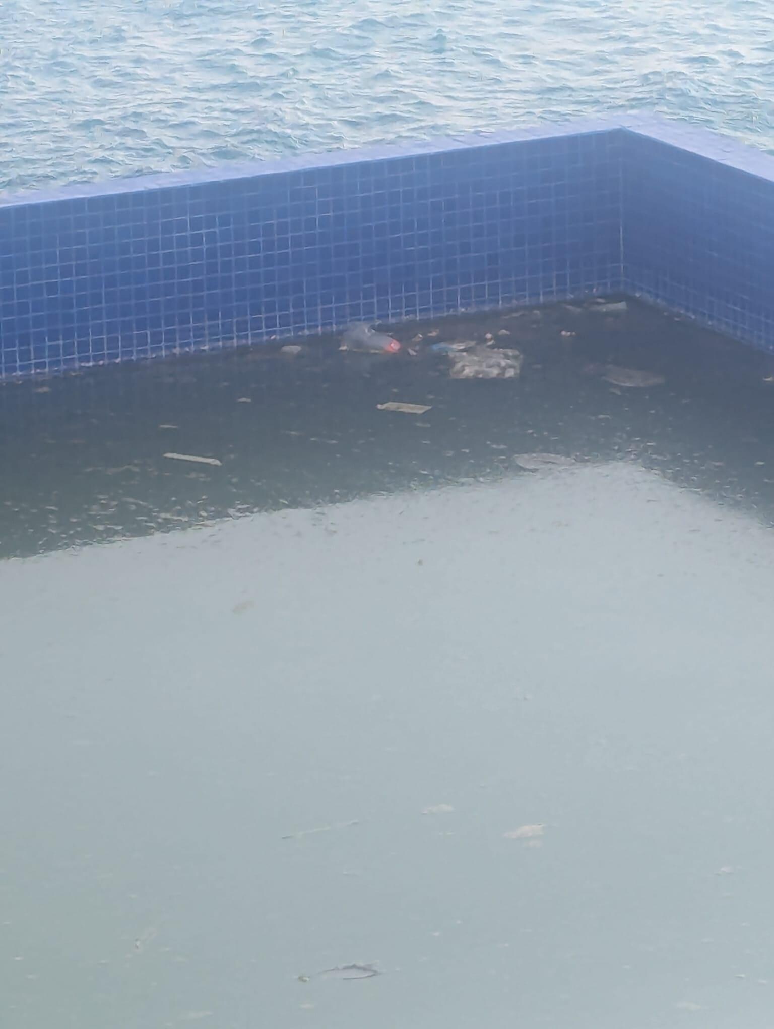 Run down pool full of trash