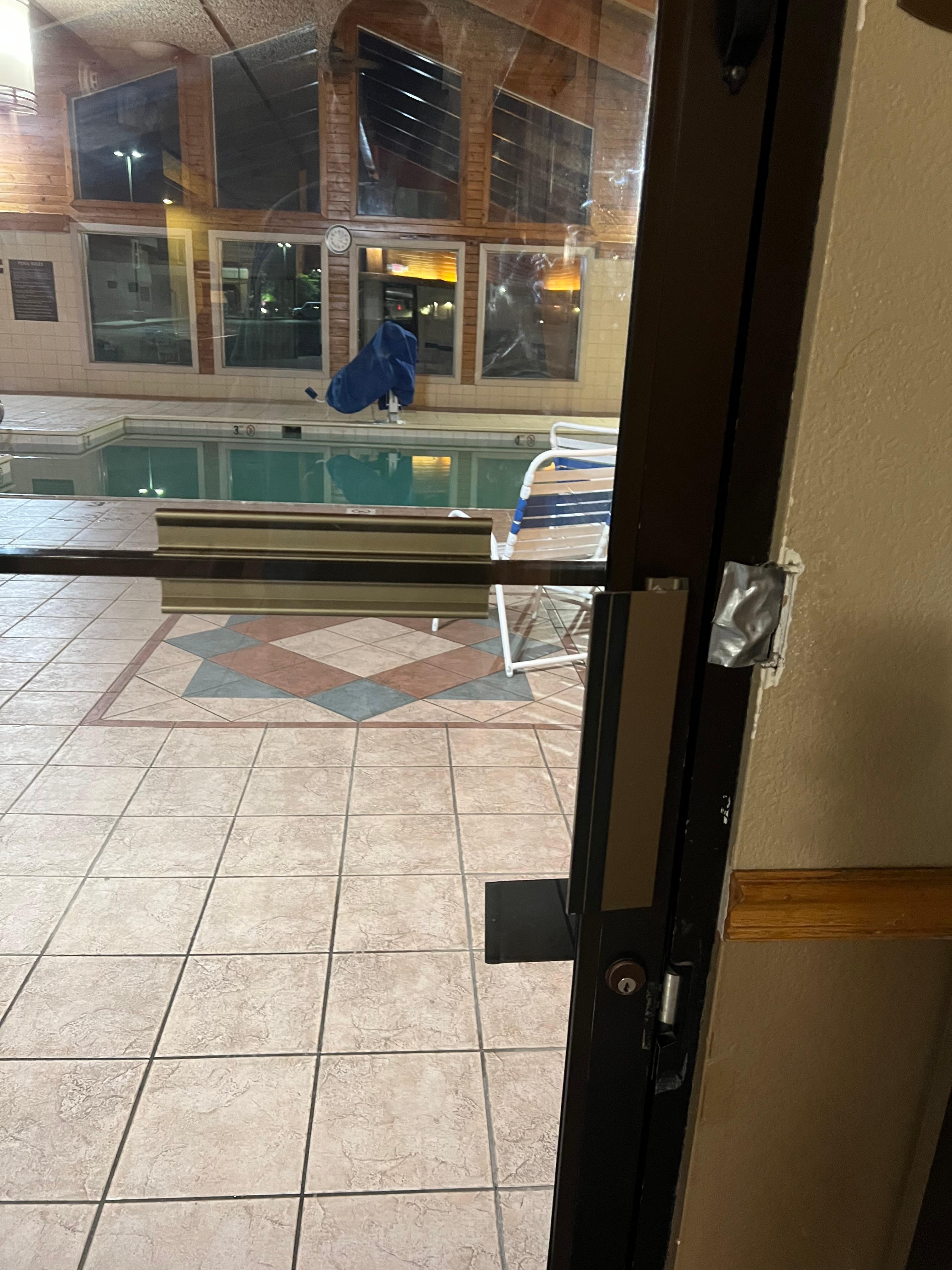 Pool door taped and not functional