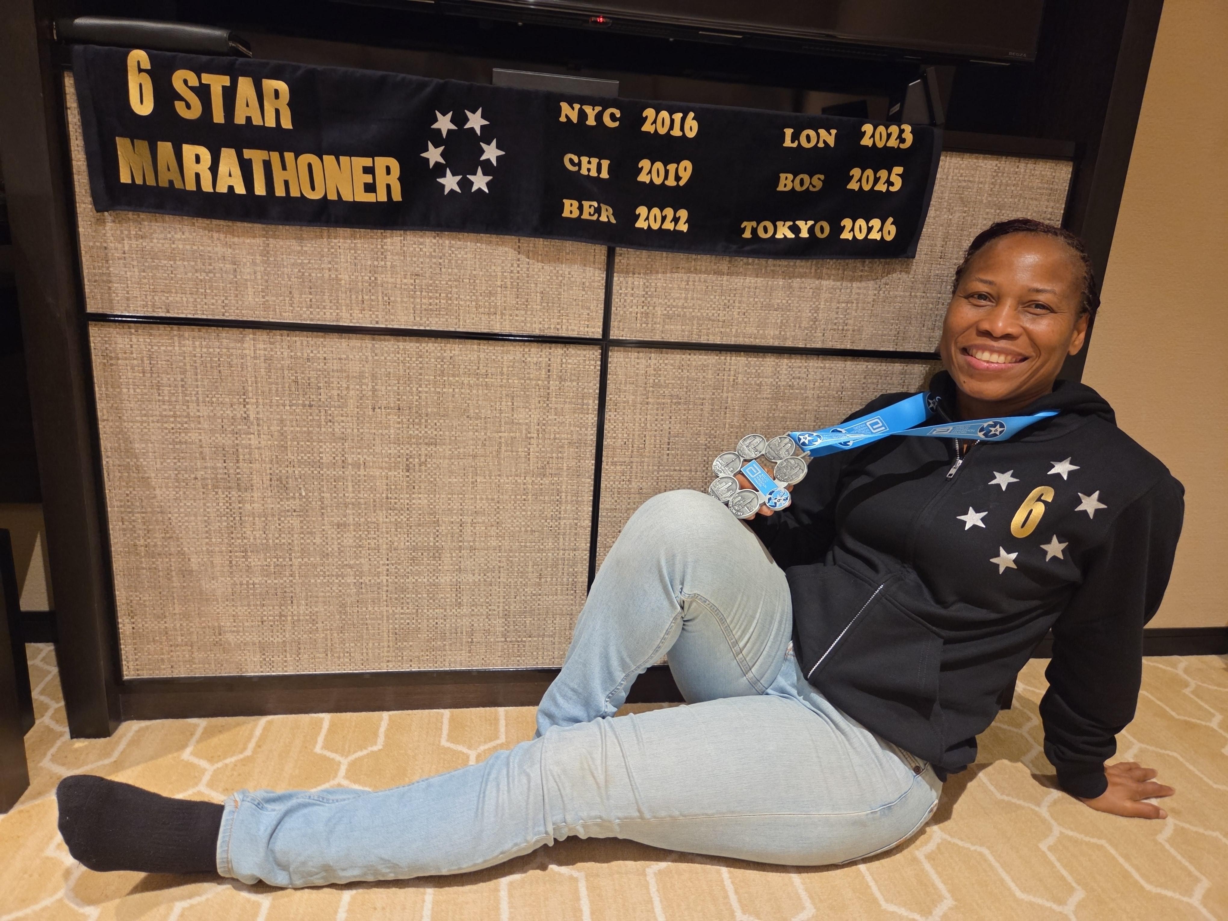 Posing with my medals from Tokyo marathon 