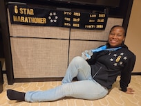 Posing with my medals from Tokyo marathon