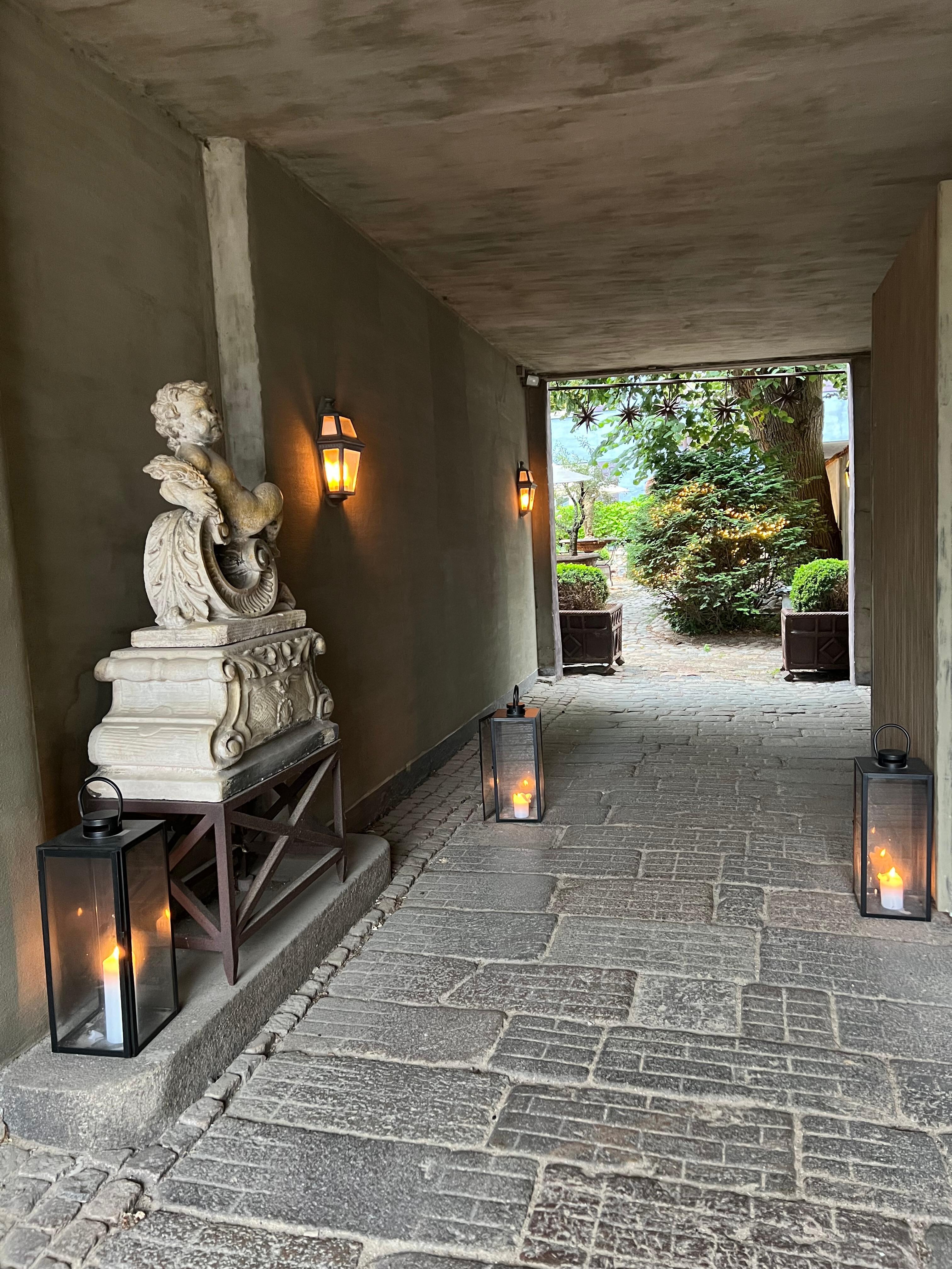 Walking through the entrance in the evening, but summer nights are still light.