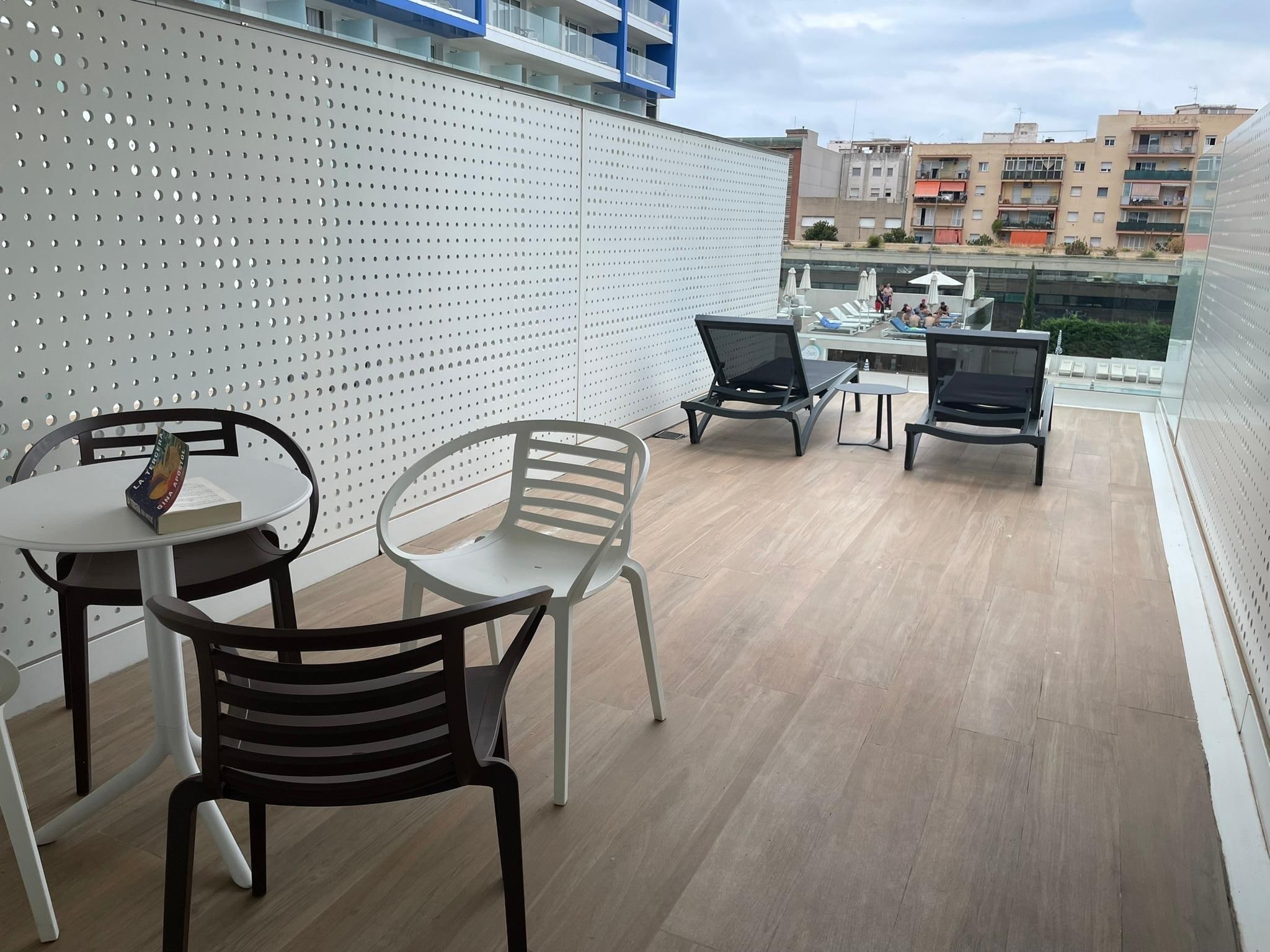 Huge balcony, part in sun and part in shade.