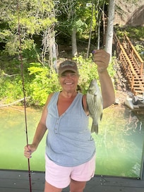 our daughter with her stripped bass