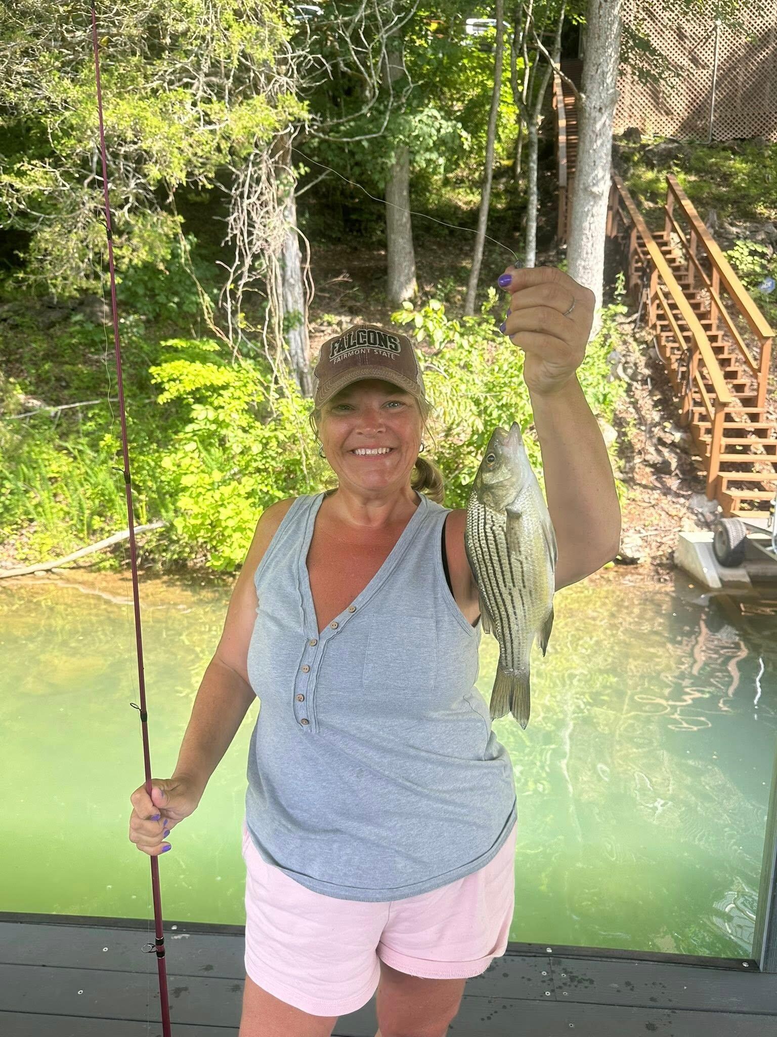 our daughter with her stripped bass