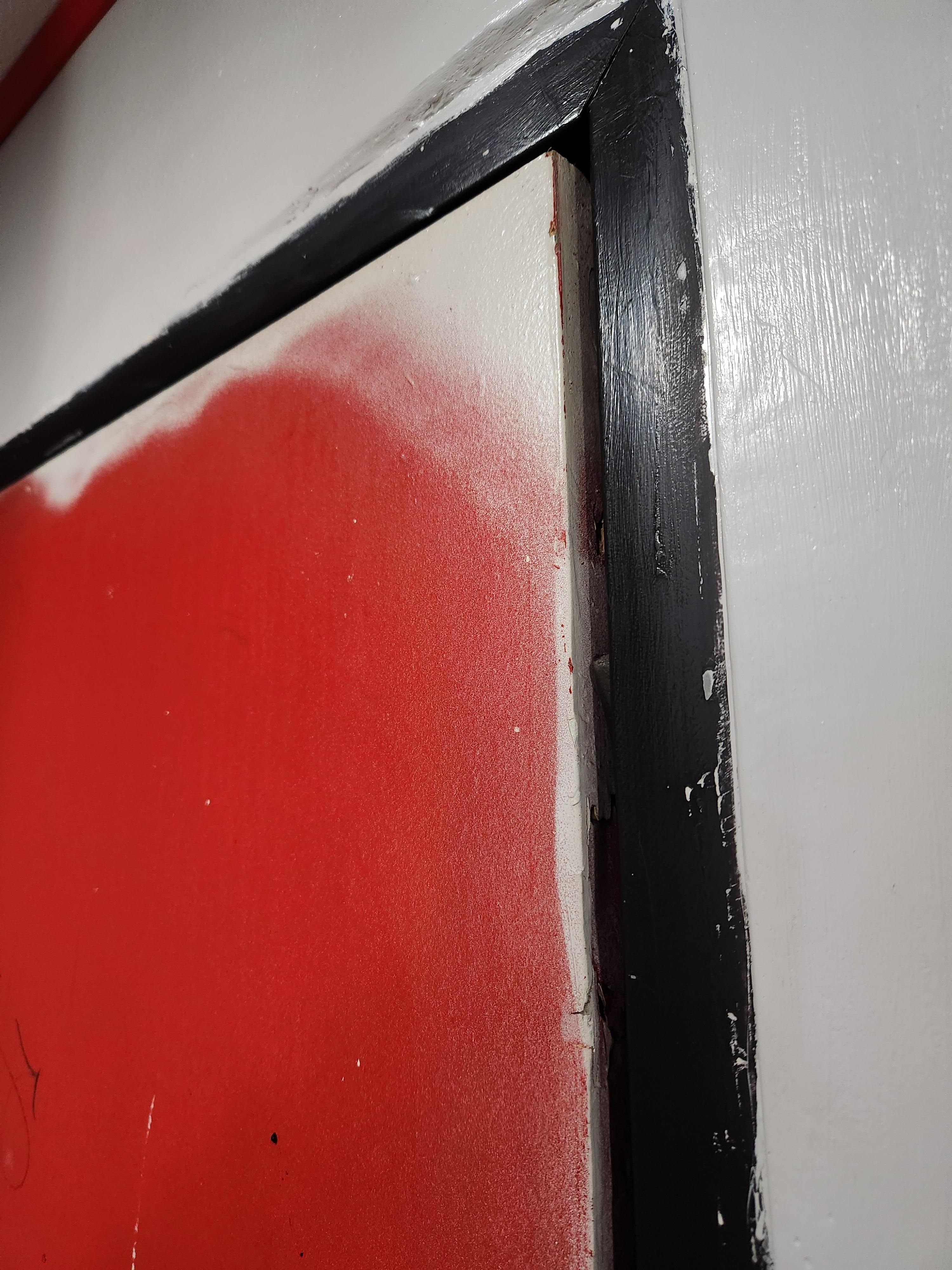The poor paint job on the door highlighted the fact that even with both locks turned, the door didn't close all the way