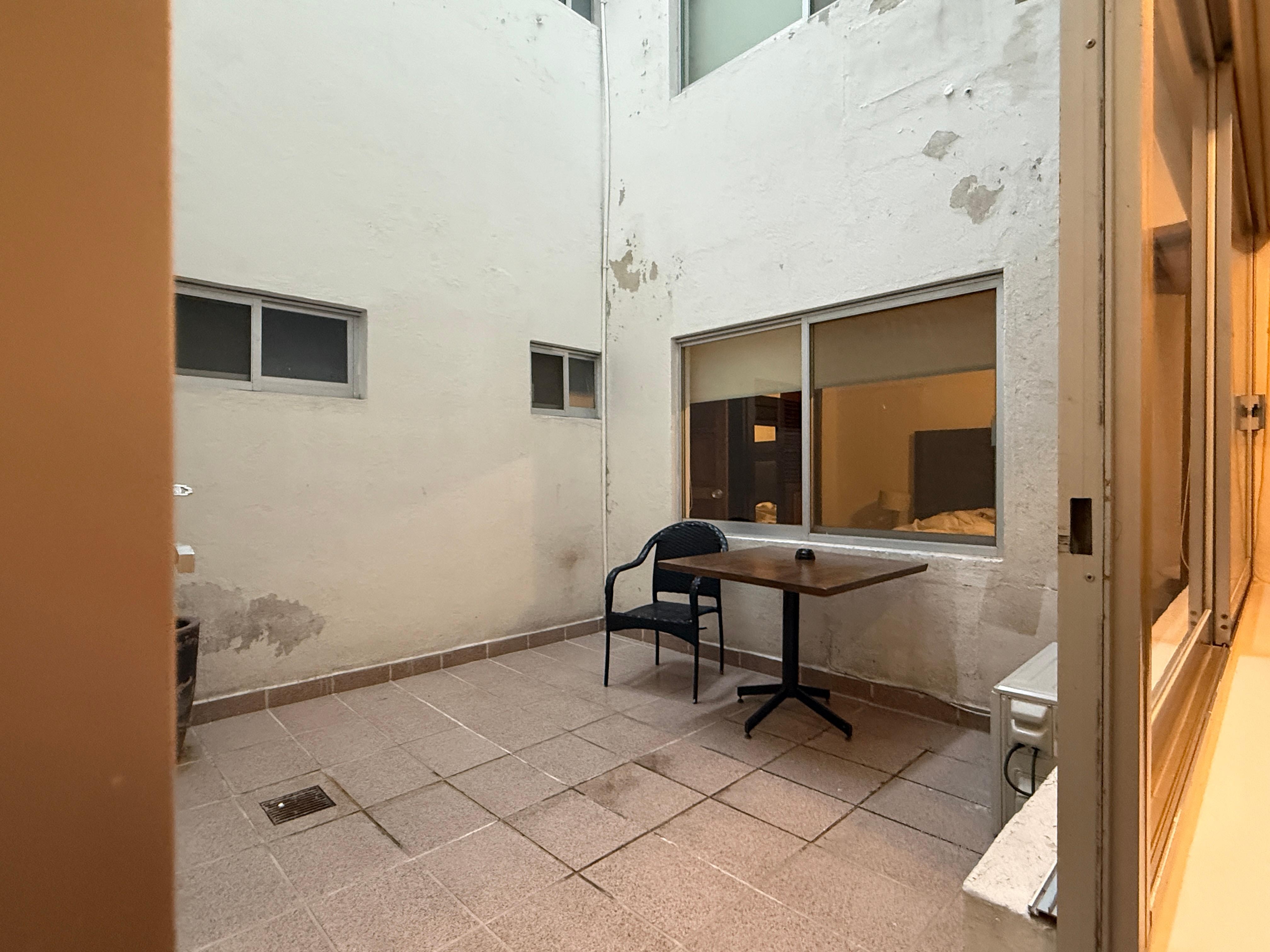 Light well seen from entry, towards sleeping area.