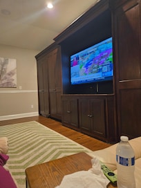 Watching TV from the recliners. Smart TVs throughout the house.