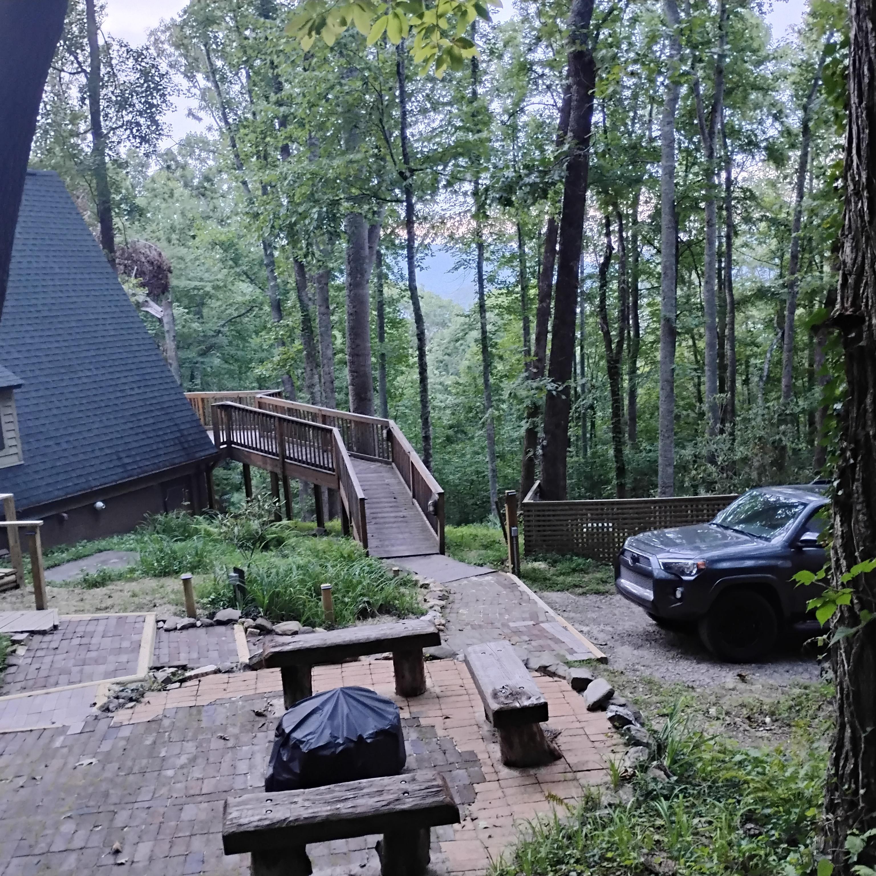 No covered carport as shown on listing.  Weathered, insect damaged fire pit area with different fire pit.