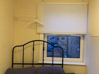 A hanging space where you have to climb on the bed to reach it isnt practical. There is a more practical space it could be.