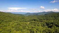 Aerial view of mountain valley behind the cottage