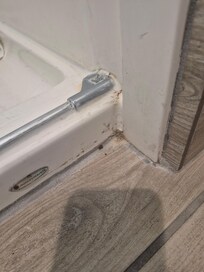 Dirty bathroom floor by shower