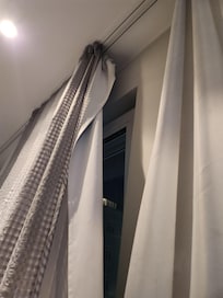 Curtain not completely on the track.