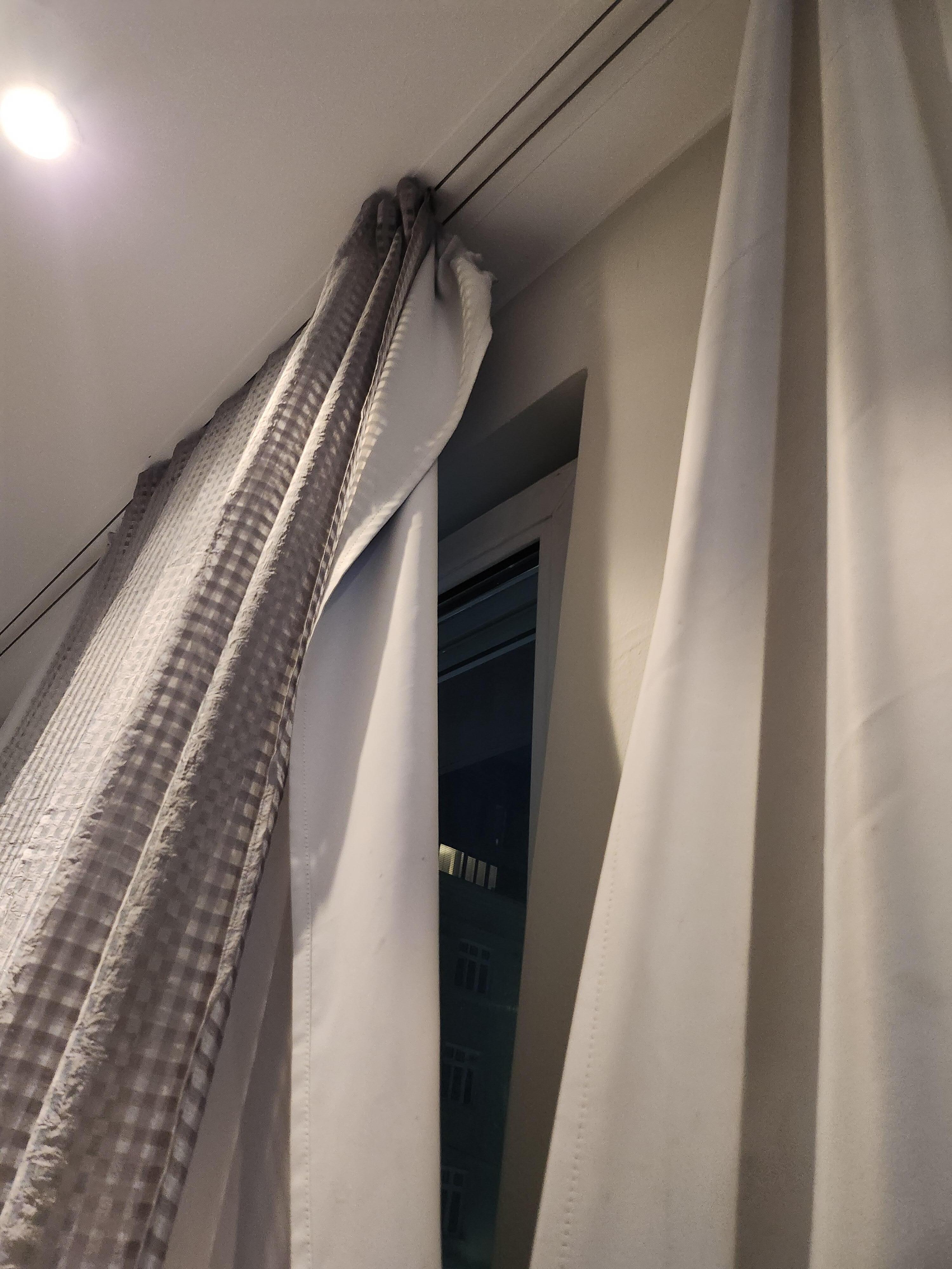 Curtain not completely on the track.