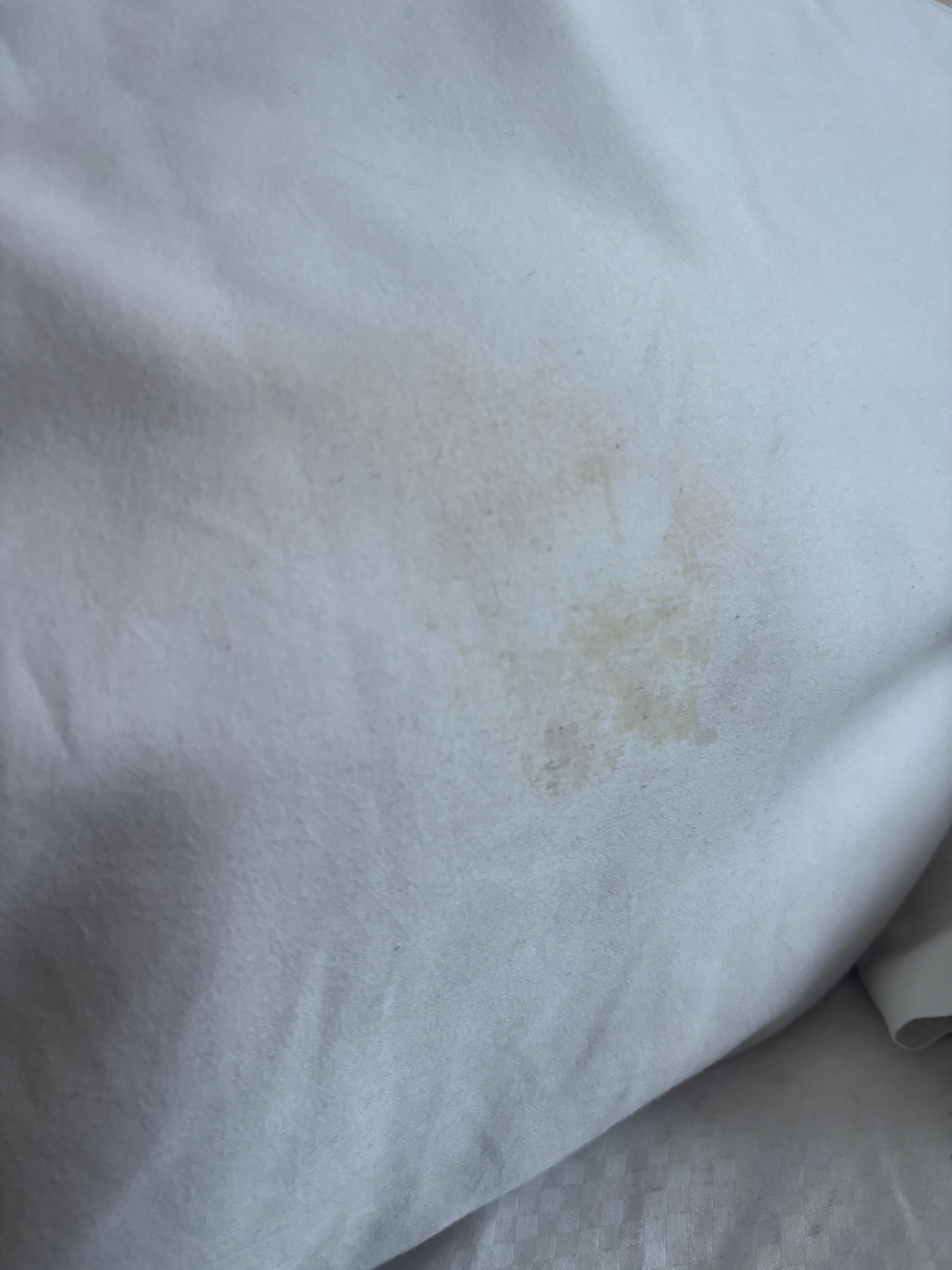 Hard sticky substance on pillows 