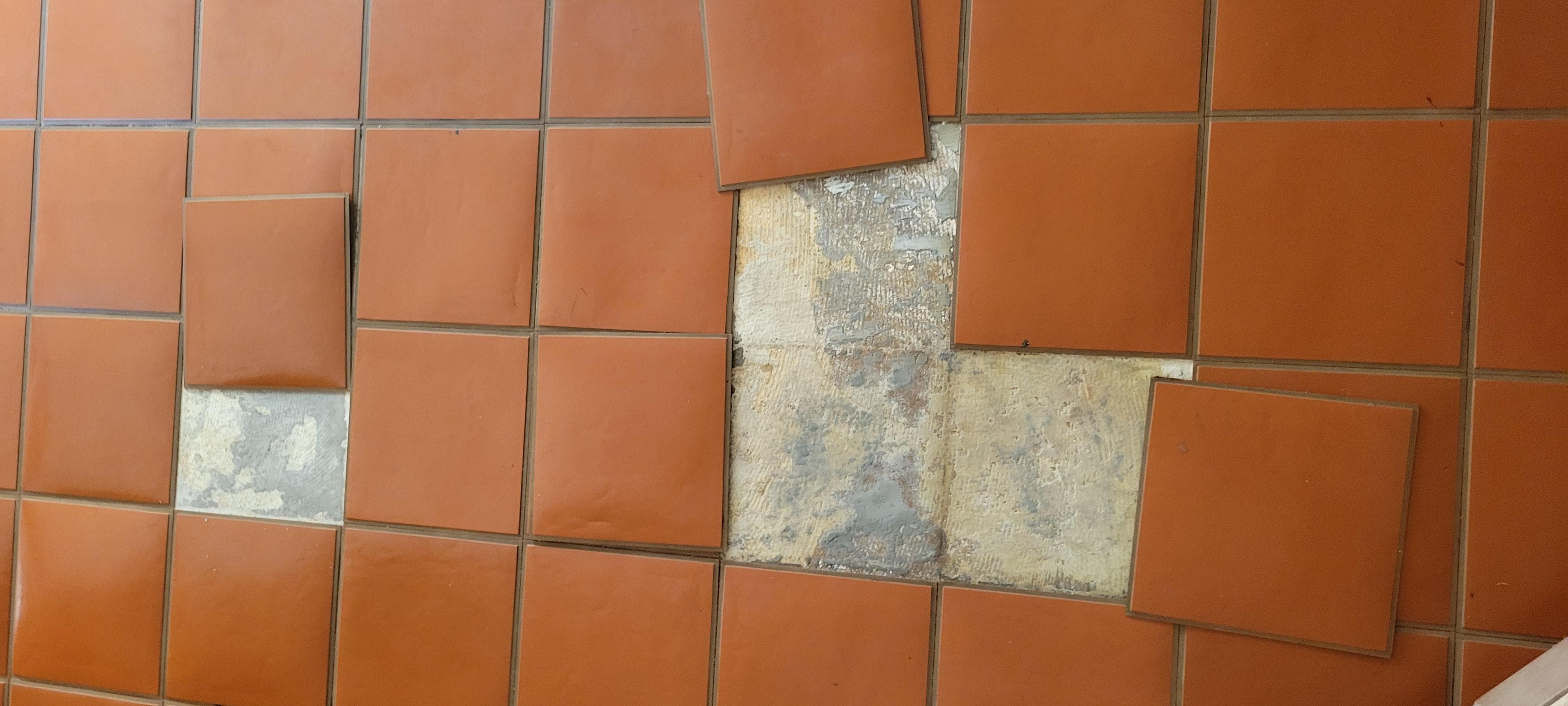 Lower floor tiles not glued down; move when you walk