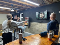 Darts in the game shed.