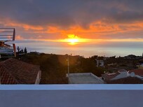 Zonsondergang vanaf dakterras