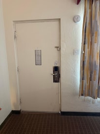 Stained doors with daylight coming through. Room stayed hot