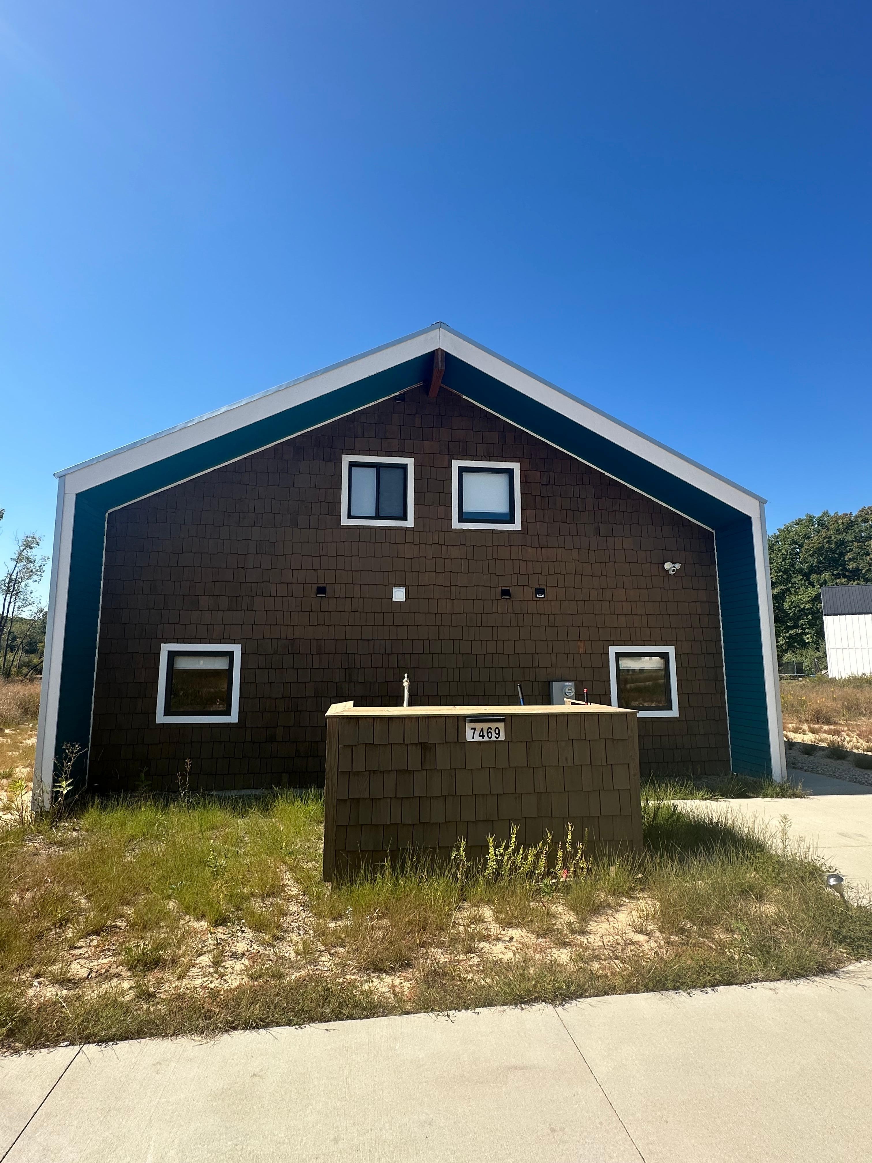 Front of home at driveway. 