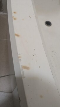 Cigarette burns on shower tub