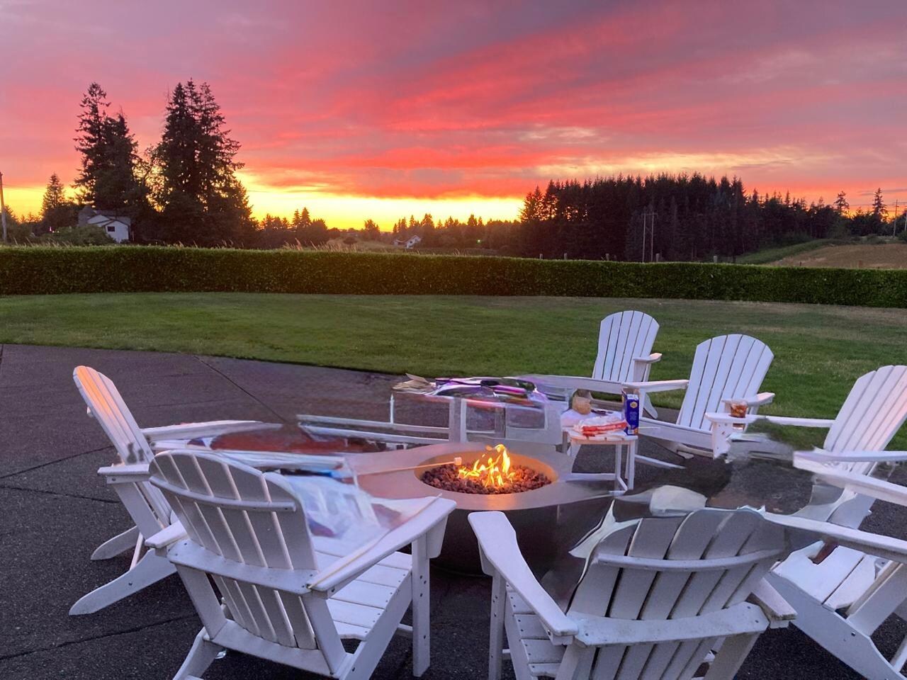 Fire pit at sunset (photo altered only to remove people in chairs for privacy)
