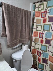 Towel hung as if used.