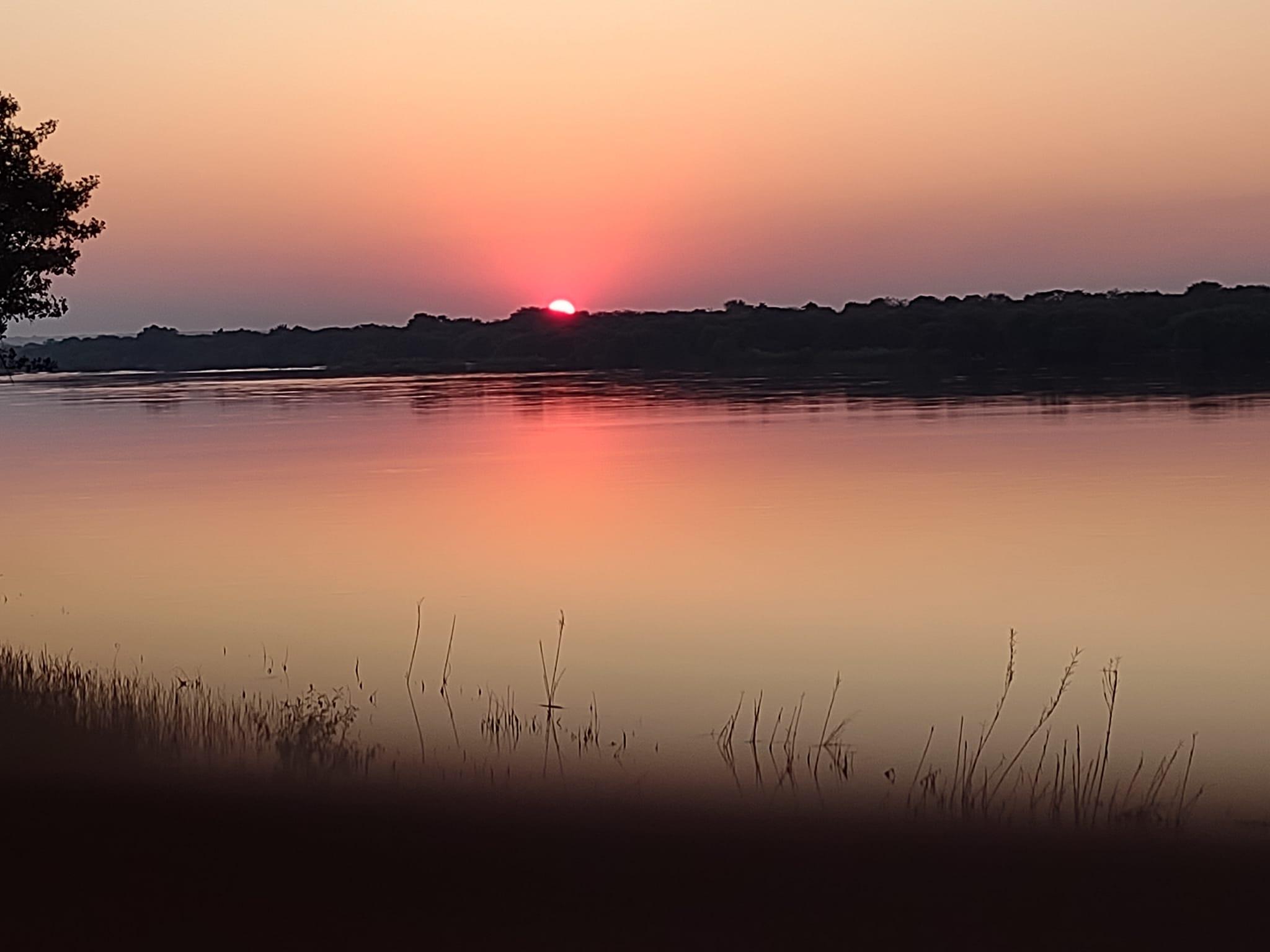 Watching sunset from the hotel's restaurant overlooking the Zambezi River