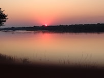 Watching sunset from the hotel's restaurant overlooking the Zambezi River