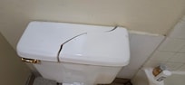 Toilet tank cover broken in half