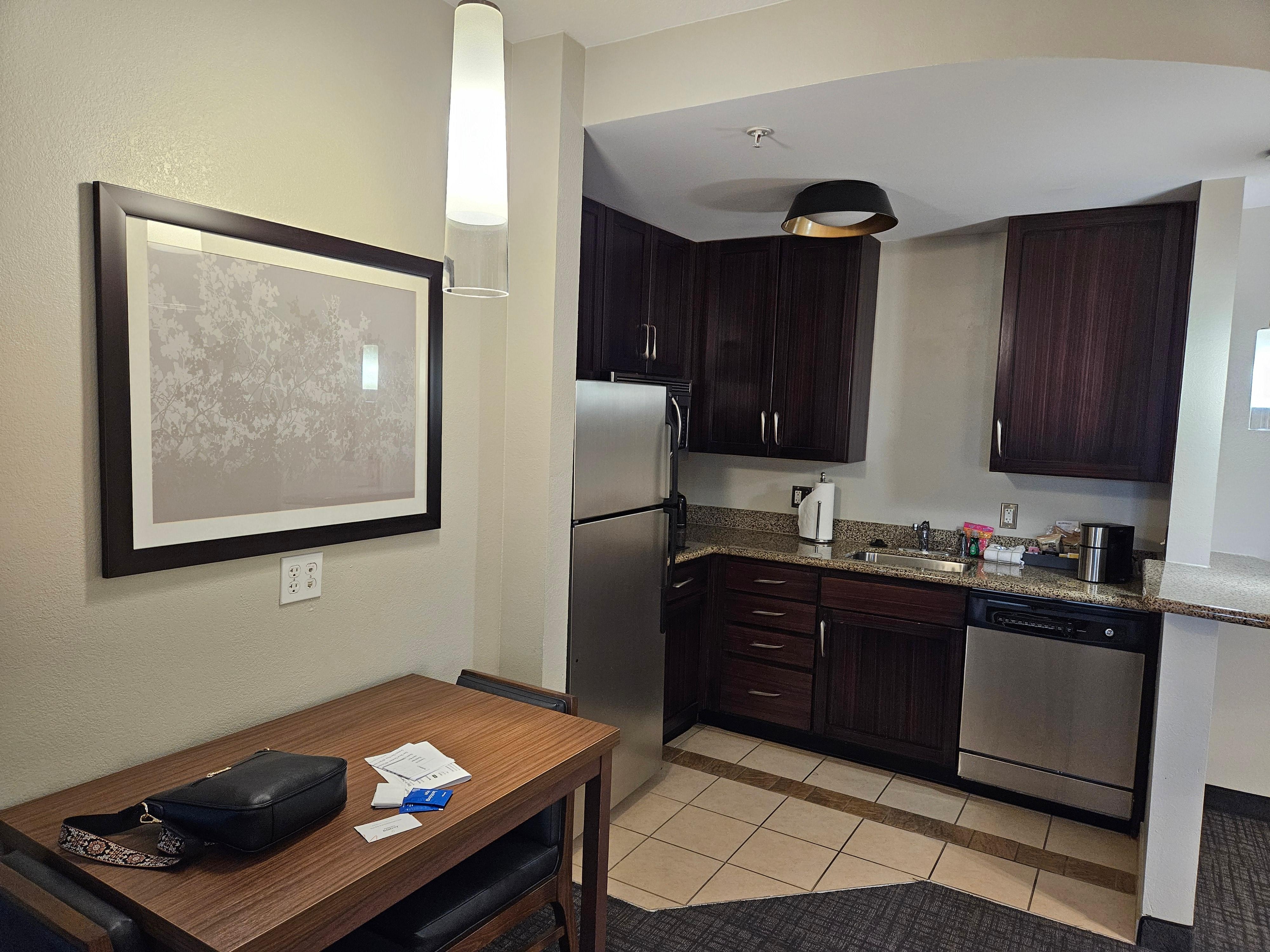 Kitchen supplied with coffee and tea, but any food you need to order separately. The microwave is pretty big size, can fit large pizza plate.