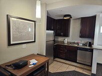 Kitchen supplied with coffee and tea, but any food you need to order separately. The microwave is pretty big size, can fit large pizza plate.