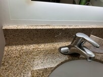 Around sink, really awful workmanship