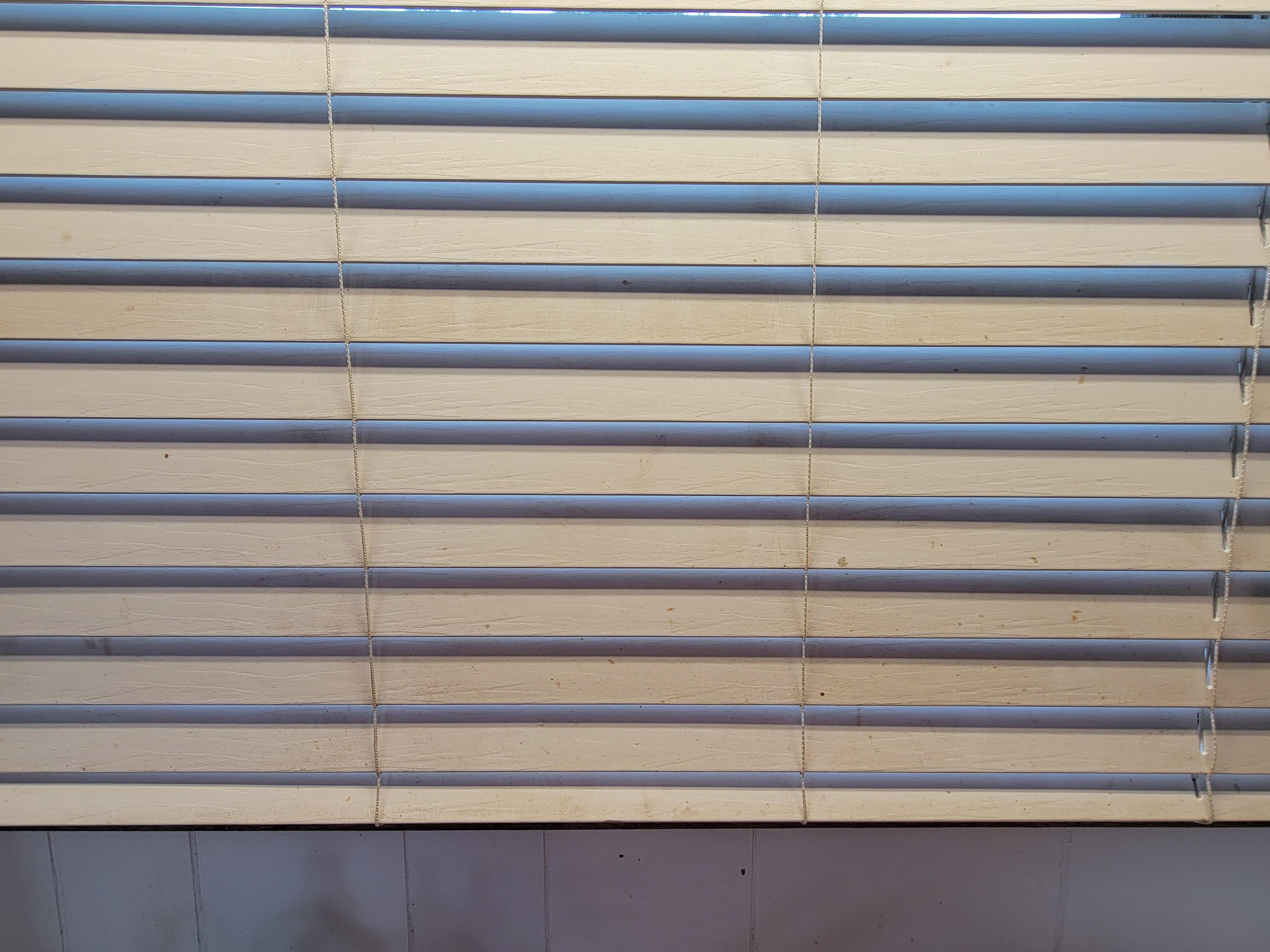 Blinds were crusted with food & debris, this was in kitchen.