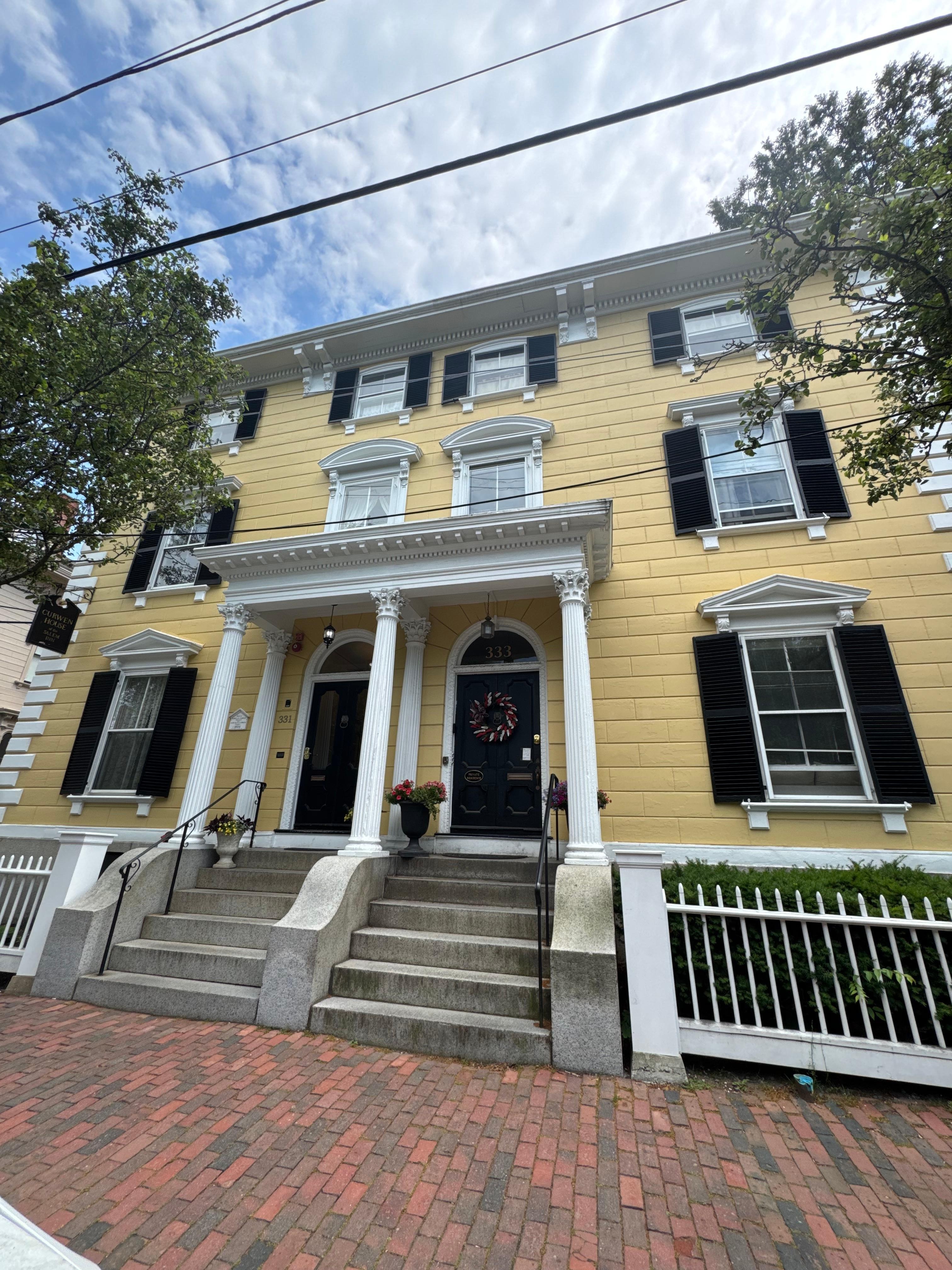 House exterior. Hotel entrance on left.