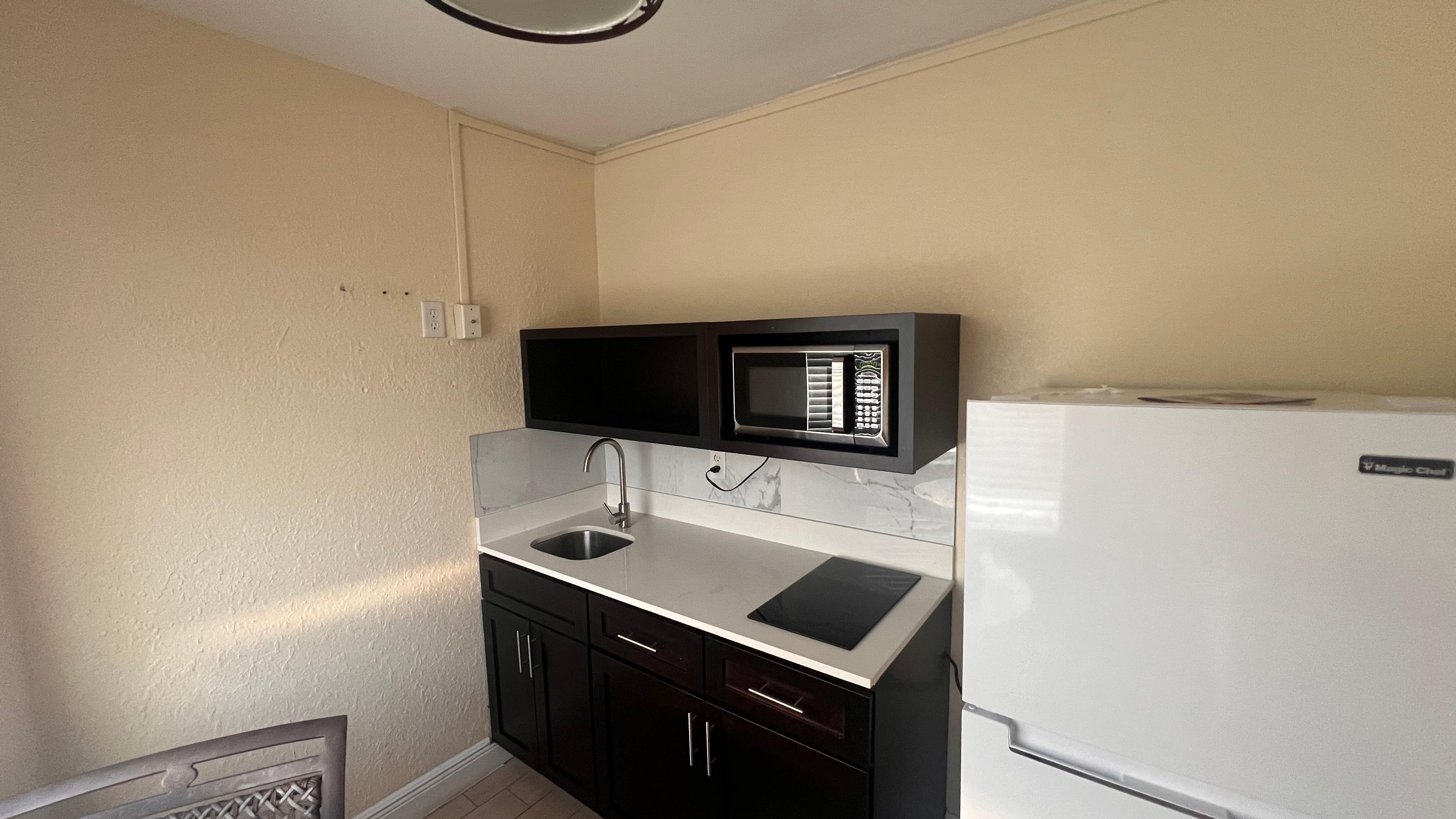 Kitchen with weed on top of cabinets 