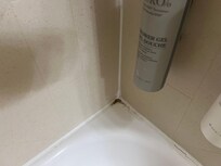 More filth on tub corner