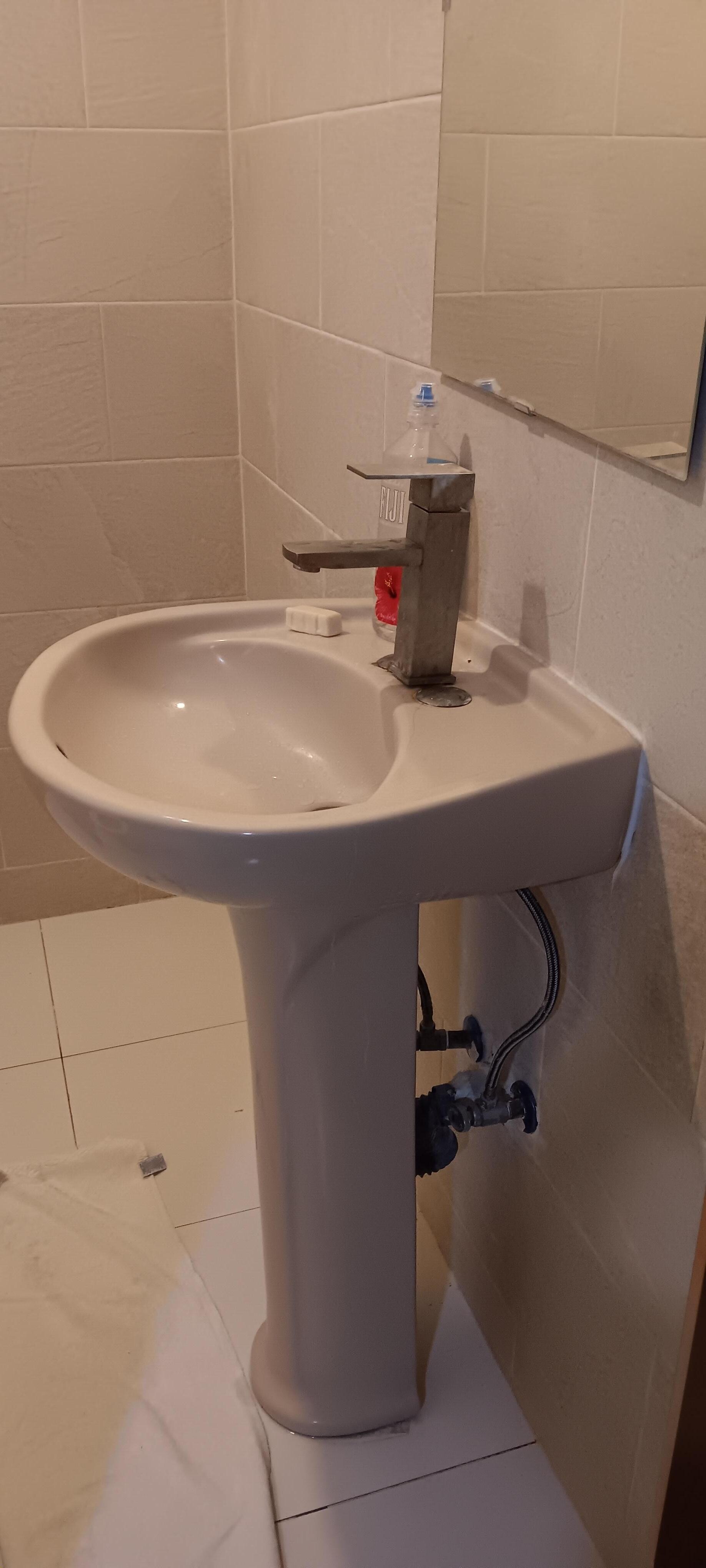 Loose faucet, sink backing up 